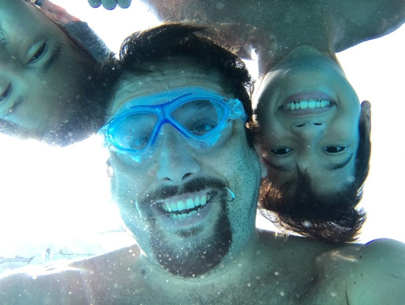 A group of people taking a selfie  Description automatically generated with low confidence